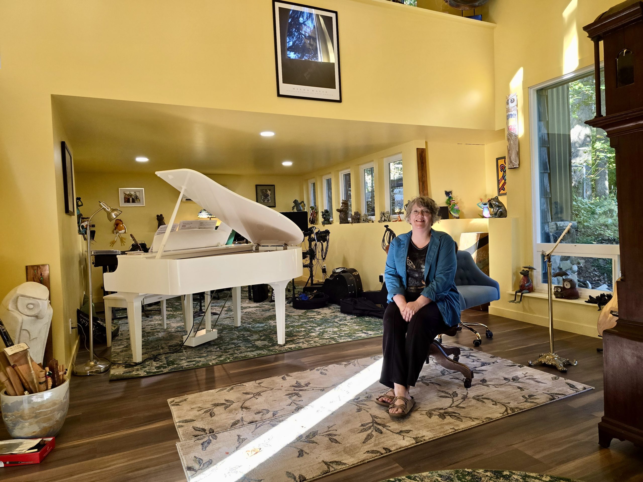 Karyn Grace sitting in her music studio